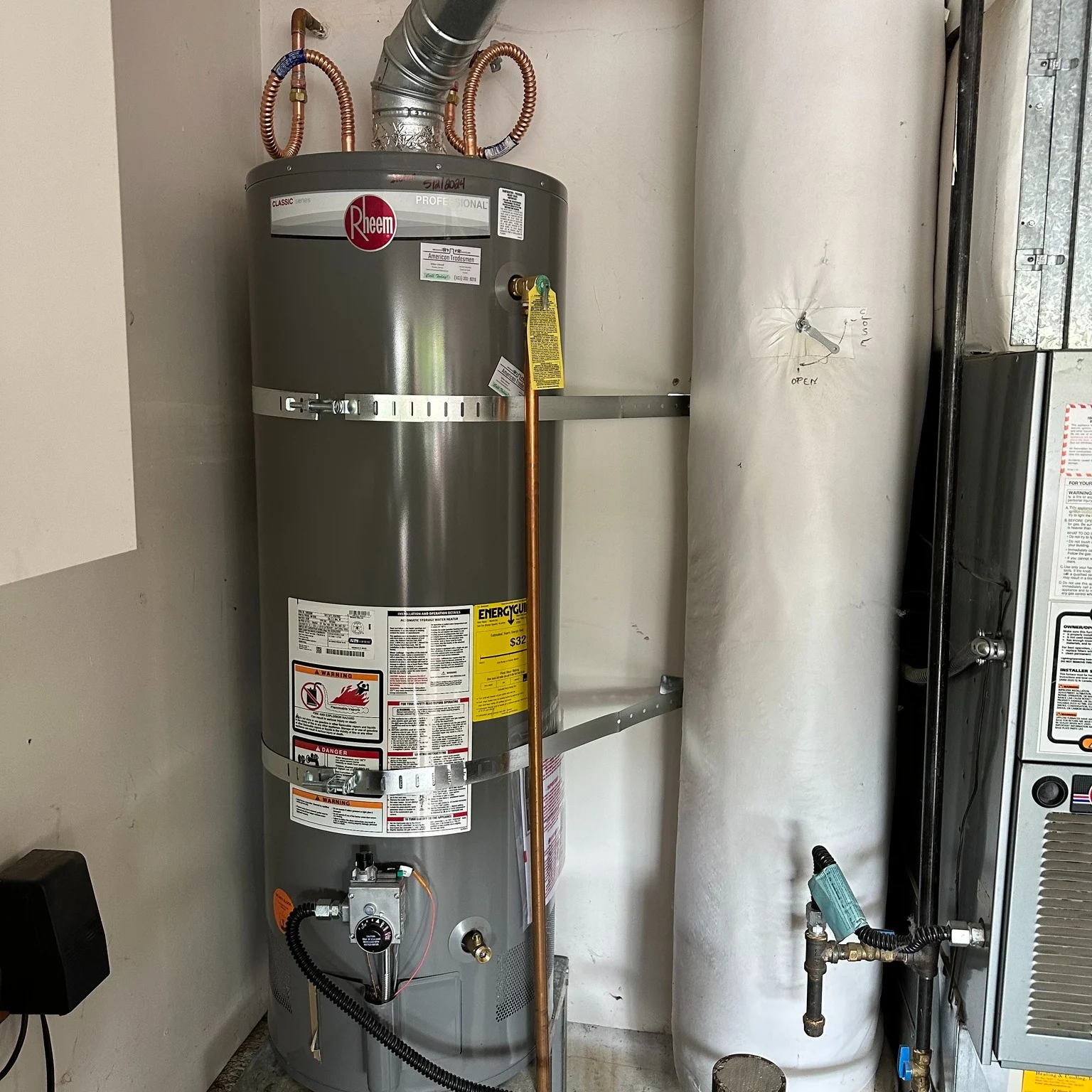 New gas water heater installed in a garage